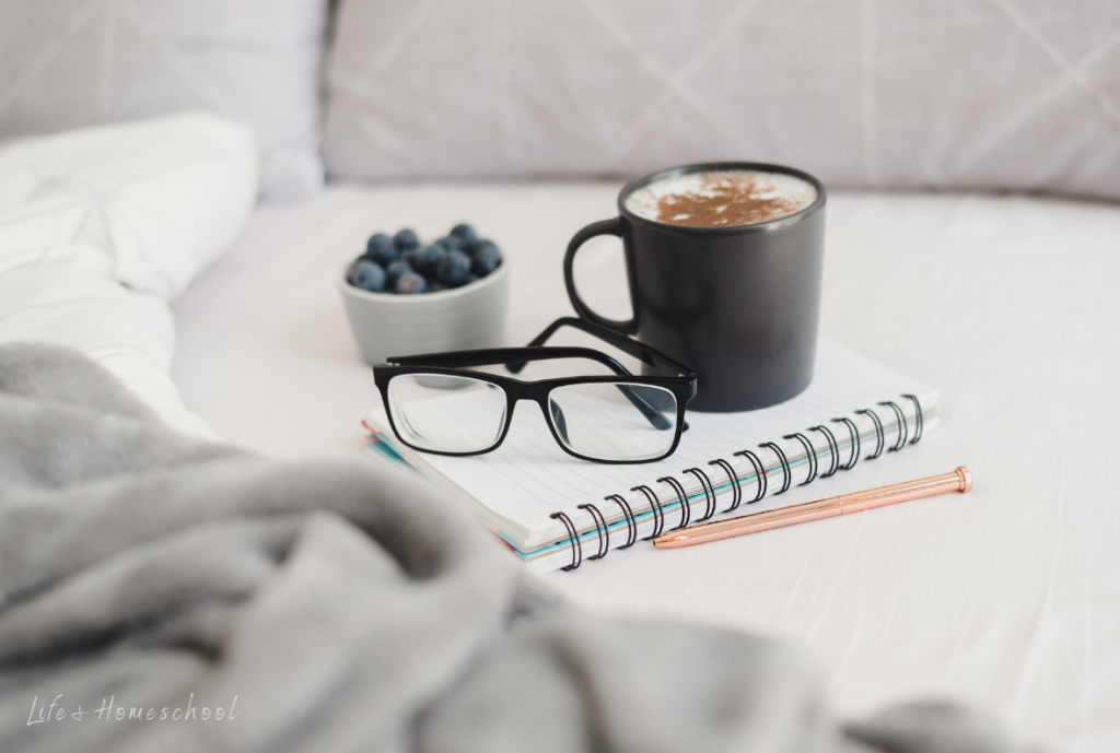 Self care notebook, coffee mug, and snack