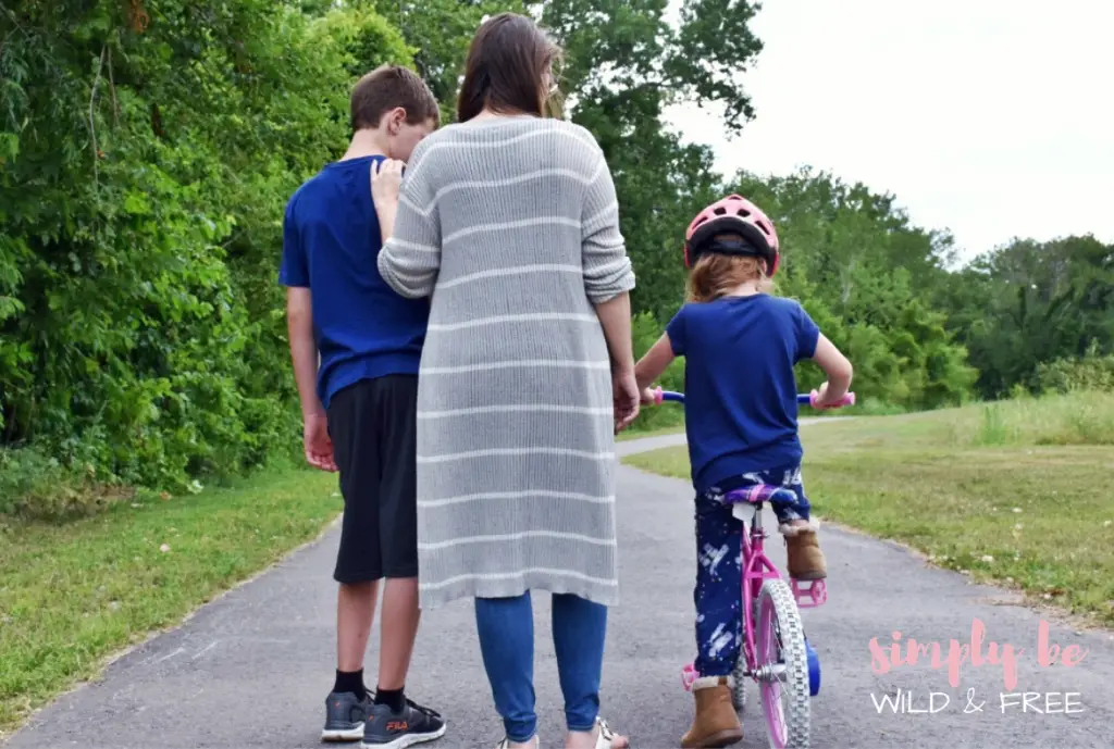 Mom walking with kids on trail