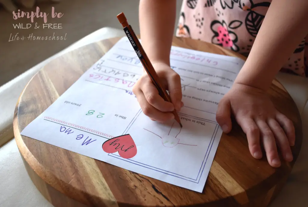 Child filling out a keepsake of Mother's Day Printables